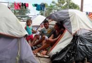 Honduran migrants Marvin Madrid and his new wife Dexy Maldonado speak during an interview with Reuters in an encampment in Matamoros