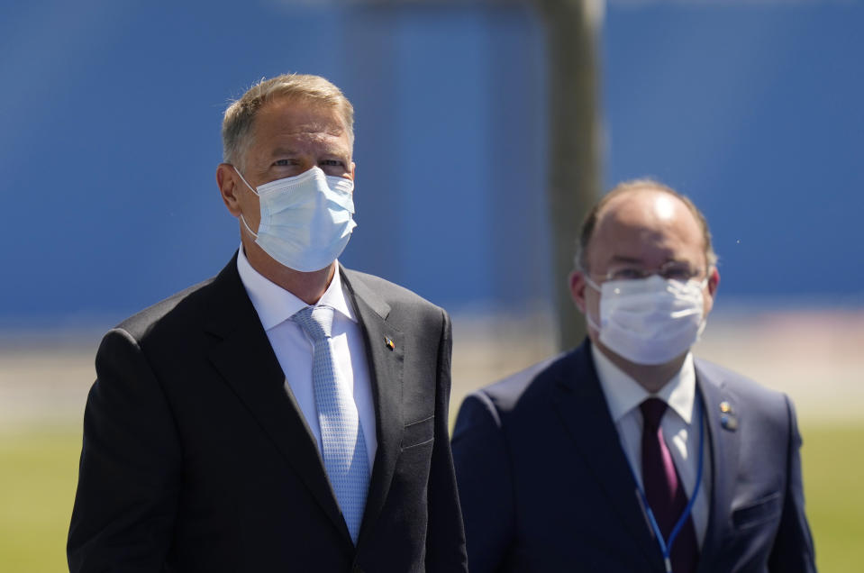 Romania's President Klaus Werner Ioannis arrives for a NATO summit at NATO headquarters in Brussels, Monday, June 14, 2021. U.S. President Joe Biden is taking part in his first NATO summit, where the 30-nation alliance hopes to reaffirm its unity and discuss increasingly tense relations with China and Russia, as the organization pulls its troops out after 18 years in Afghanistan.(AP Photo/Francisco Seco, Pool)