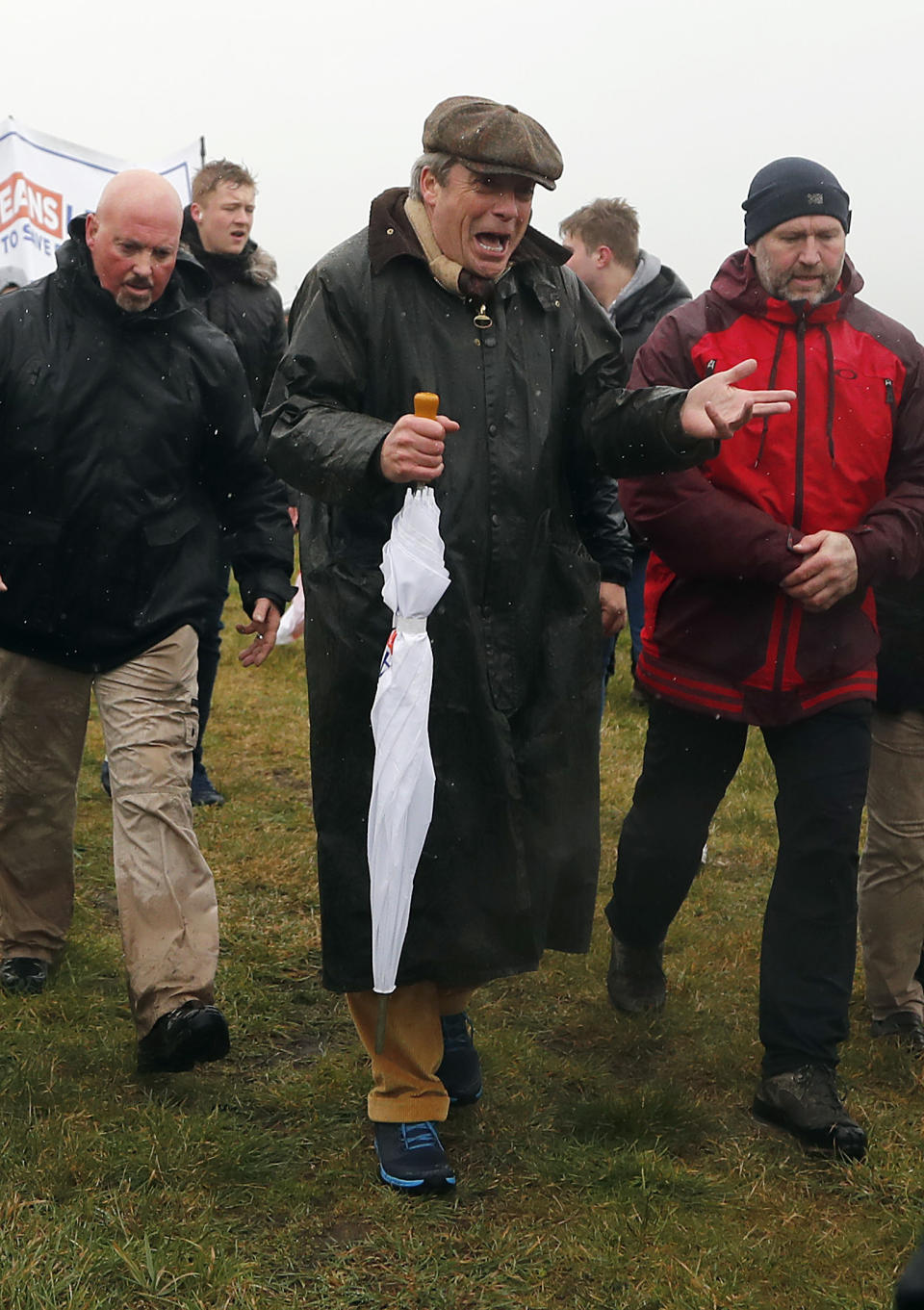 Former UKIP party leader Nigel Farage joins the start of the first leg of March to Leave the European Union, in Sunderland, England, Saturday, March 16, 2019. Hard-core Brexiteers led by former U.K. Independence Party leader Nigel Farage set out on a two-week "Leave Means Leave" march between northern England and London, accusing politicians of "betraying the will of the people." (AP Photo/Frank Augstein)