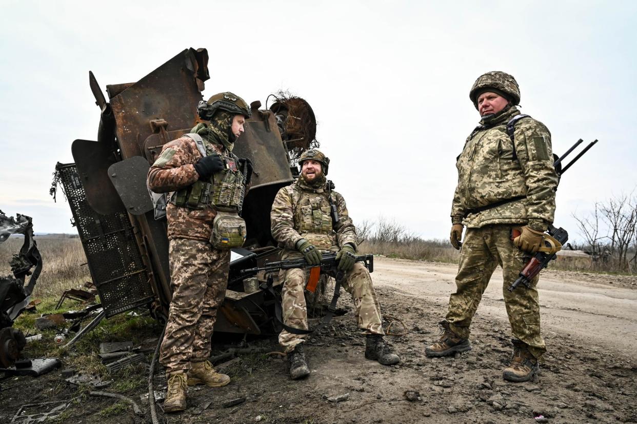<span>Ukrainian soldiers of 65th separate mechanised brigade rest near Robotyne, Zaporizhzhia region, during Russia’s war.</span><span>Photograph: Ukrinform/REX/Shutterstock</span>