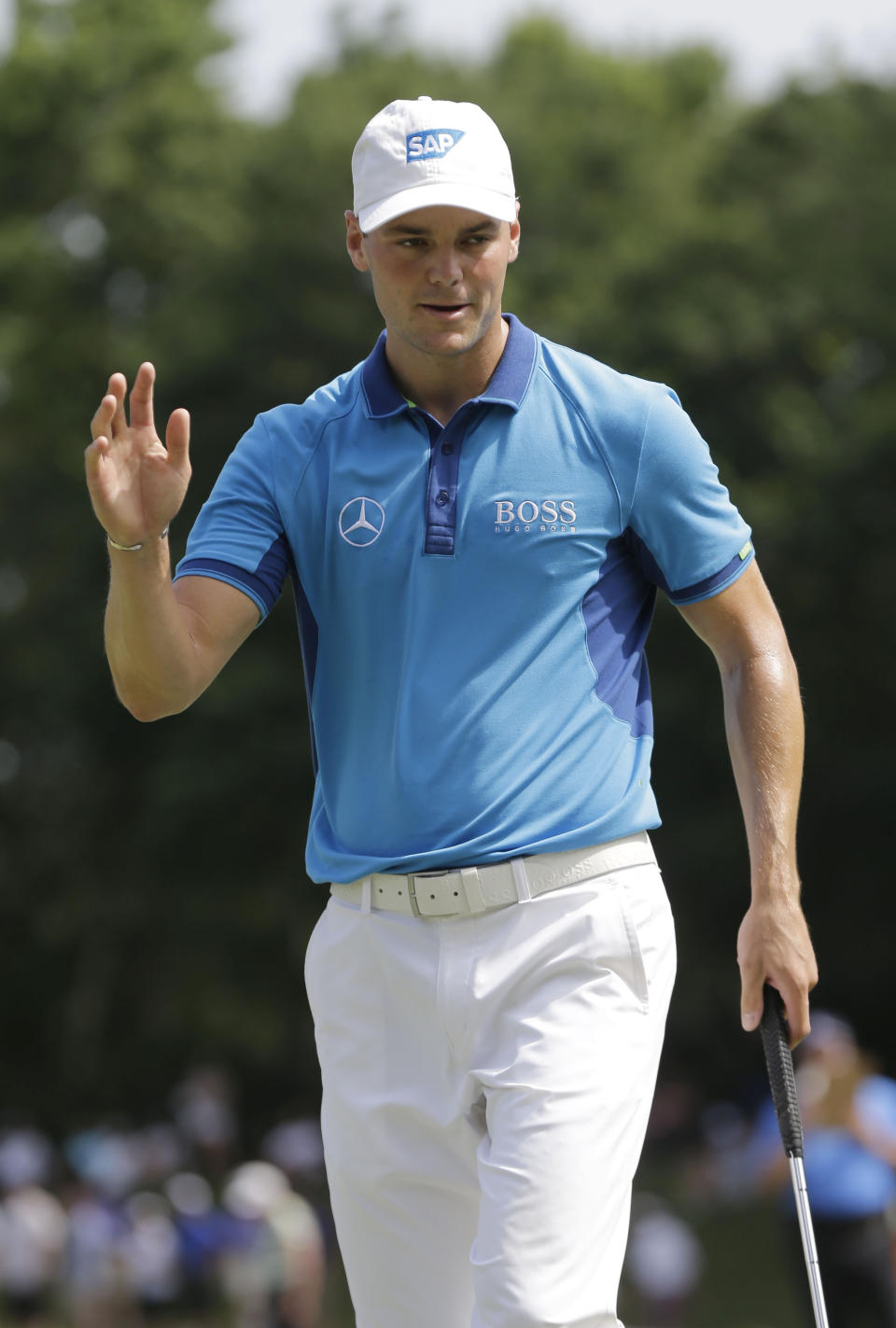 Martin Kaymer, of Germany, waves after making birdie on the sixth hole during the third round of The Players championship golf tournament at TPC Sawgrass, Saturday, May 10, 2014, in Ponte Vedra Beach, Fla. (AP Photo/Gerald Herbert)