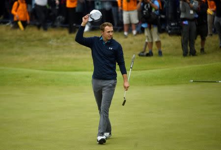 USA's Jordan Spieth acknowledges the crowd after holing a putt on the 18th green to win The Open Championsip REUTERS/Hannah McKay