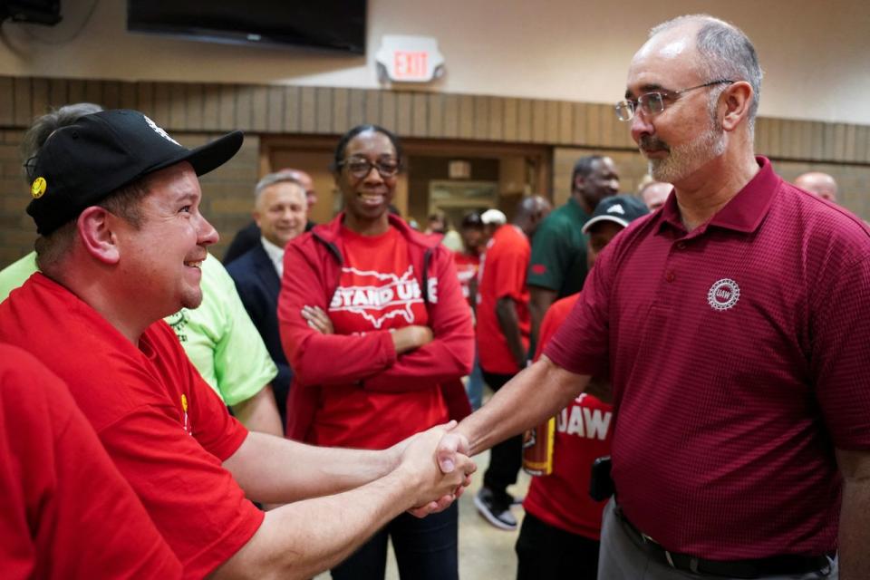 UAW President Shawn Fain, wearing polo shirt, attended a watch party on Friday for the VW union vote.