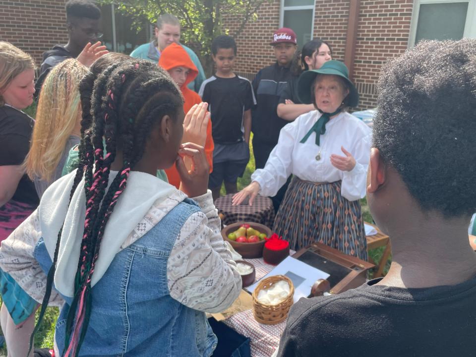Students crowd around Paula Warrenfeltz portraying a volunteer for the U.S. Sanitary Commission. She was among the reenactors visiting Bester Elementary on Wednesday in Hagerstown.
