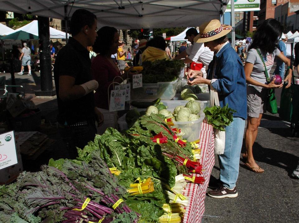 This July 2013 photo shows a farmer’s market in Boise, Idaho. Sure you have to pay for the locally grown fruit, vegetables, grass-fed beef or the various arts and crafts for sale, but the sights, smells, sounds and people-watching are free at Boise’s version of the classic farmer’s market. In three separate spots downtown, vendors set up shop on blocked-off city streets or plazas each Saturday morning from April through December. (AP Photo/Boise Parks & Recreation, Bill Grange)