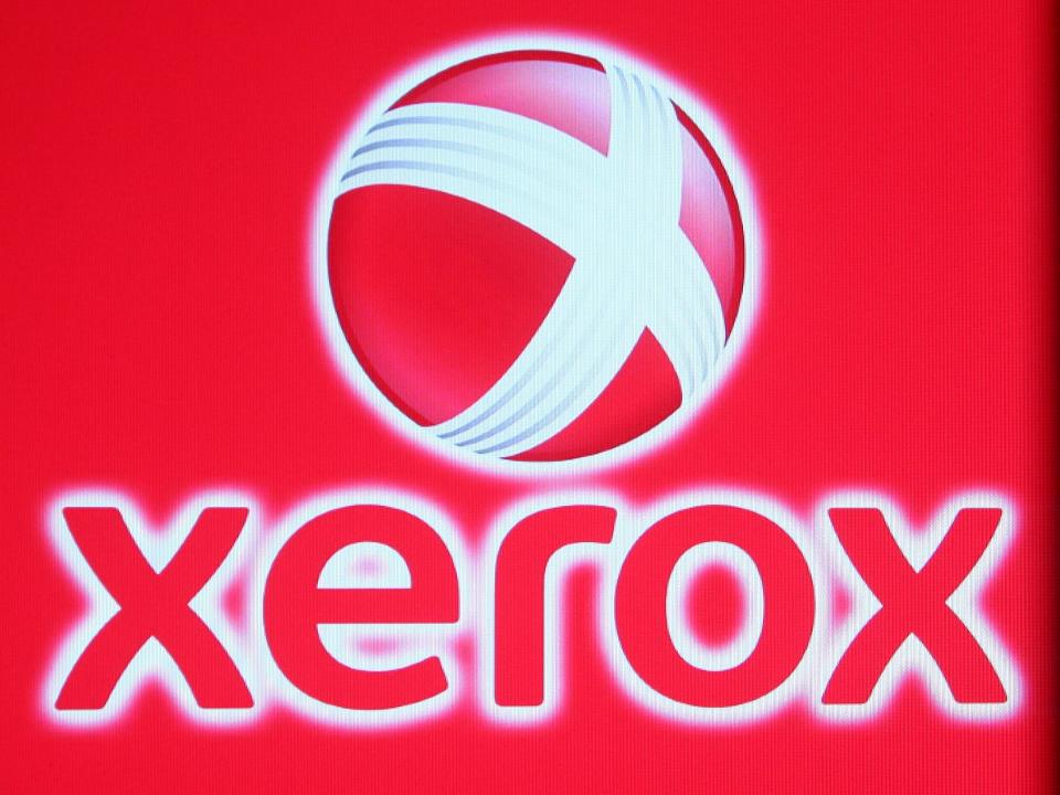 The Xerox logo of white and red sits on a black background