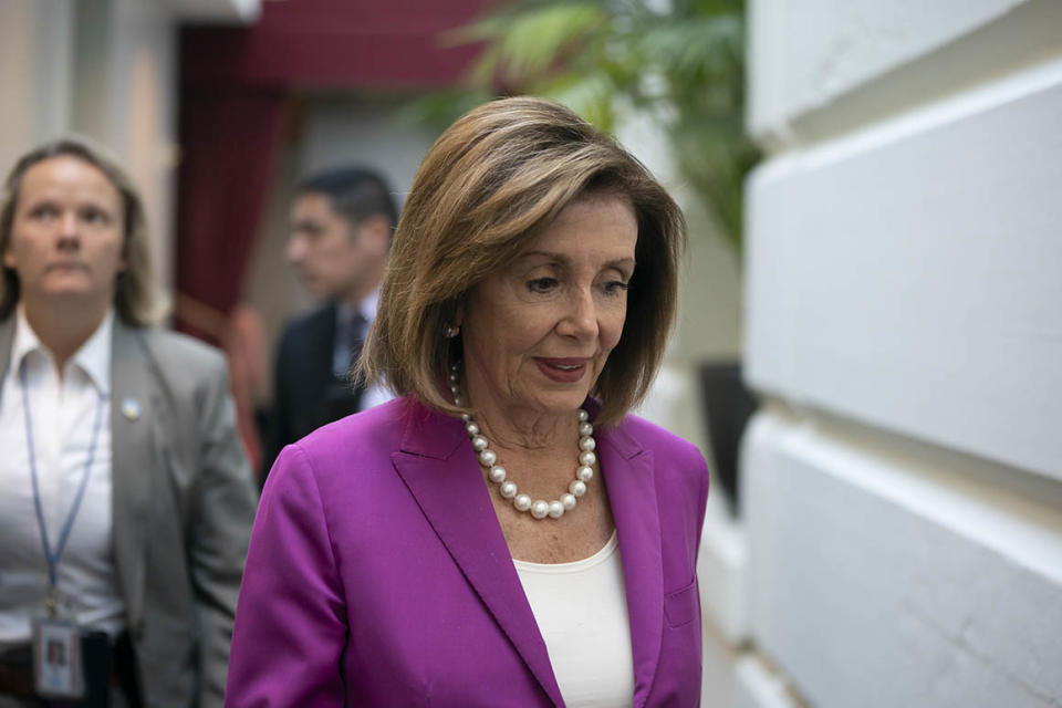 House Speaker Nancy Pelosi, D-Calif., arrives for a closed-door session with her caucus before a vote on a resolution condemning what she called 