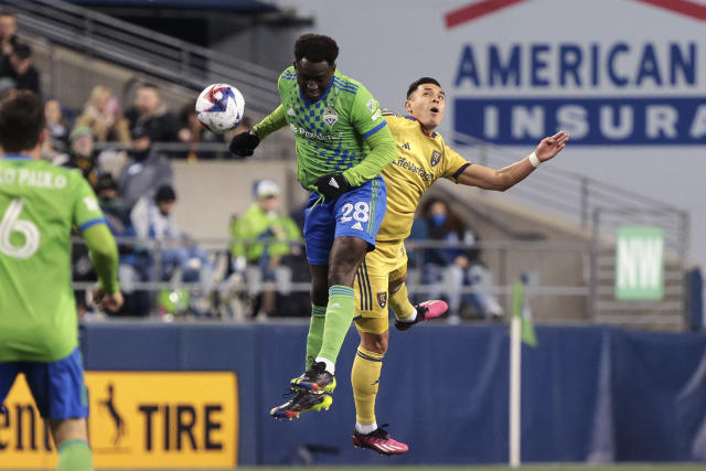 Seattle Sounders defender Yeimar Gomez, left, heads the ball away from Real Salt Lake forward Rubio Rubin during the second half of an MLS soccer match Saturday, March 4, 2023, in Seattle. The Sounders won 2-0. (AP Photo/Jason Redmond)