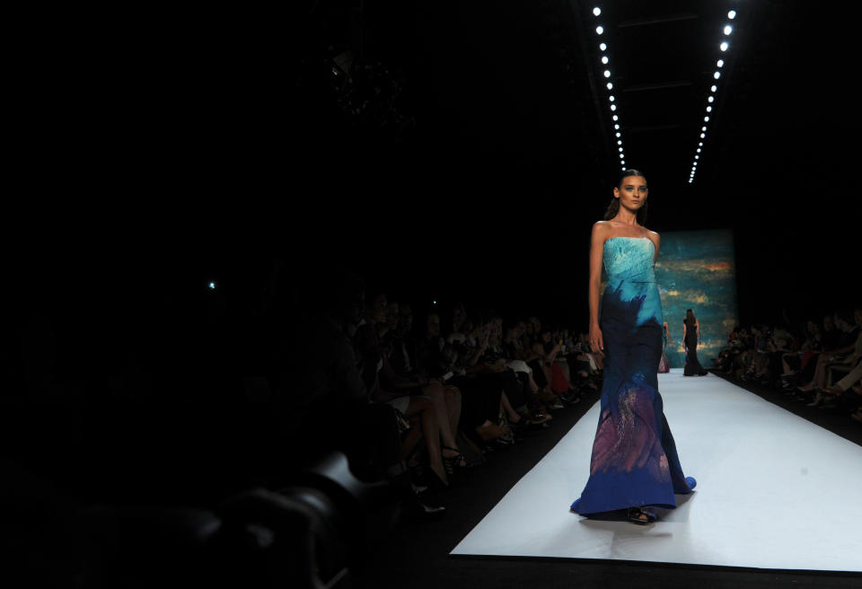 A model walks the runway at the Monique Lhuillier spring 2013 show, Saturday, Sept. 8, 2012, during Fashion Week in New York. (AP Photo/Diane Bondareff)