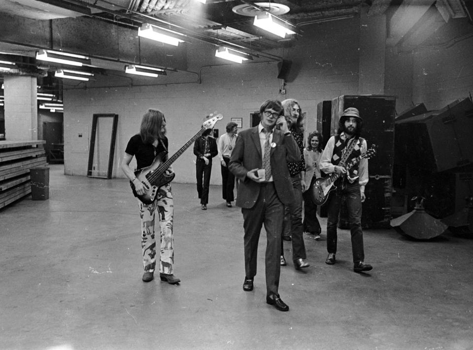 <p>Led Zeppelin's bassist, John Paul Jones, singer, Robert Plant, and guitarist, Jimmy Page, walk backstage at the Forum in Los Angeles in 1977. </p>