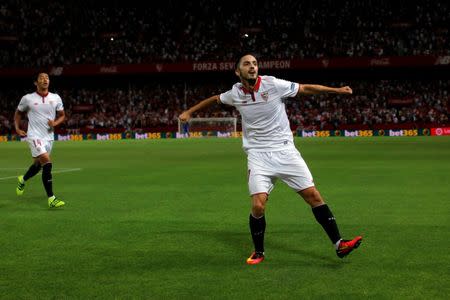 Football Soccer - Sevilla v Espanyol - Spanish La Liga Santander - Ramon Sanchez Pizjuan stadium, Seville, Spain - 20/08/16 Sevilla's Pablo Sarabia (R) and Hiroshi Kiyotake celebrate a goal against Espanyol. REUTERS/Jon Nazca