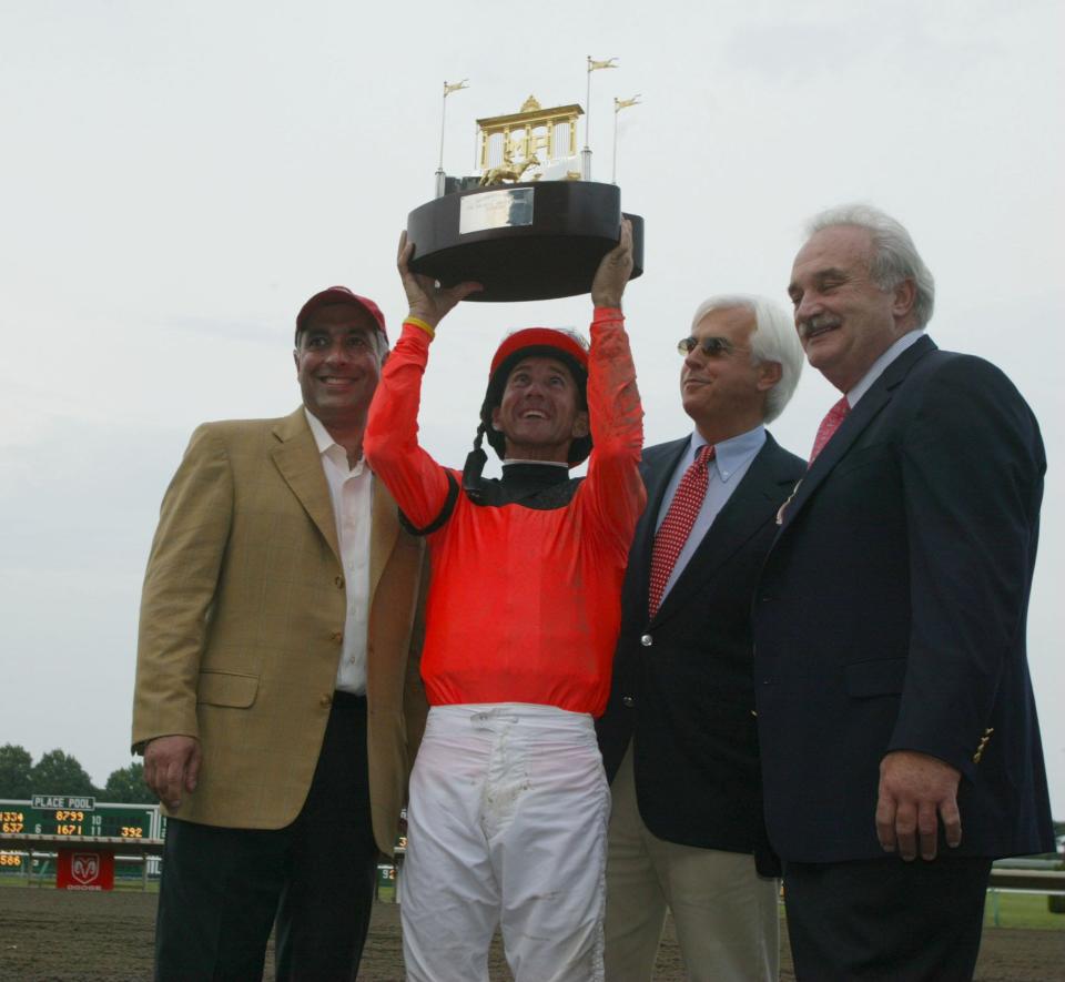 08/07/05 (sports):  Oceanport:  Haskell Day at Monmouth Park Racetrack:  L-R:  Co-owner Dave Shimmon, jockey Jerry Bailey, trainer Bob Baffert, and co-owner Bill Bianco celebrate Roman Ruler's Haskell win.