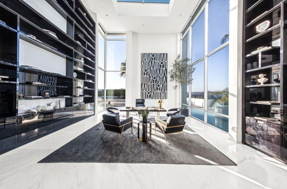 a black and white room overlooking a pool in mansion The One Bel Air
