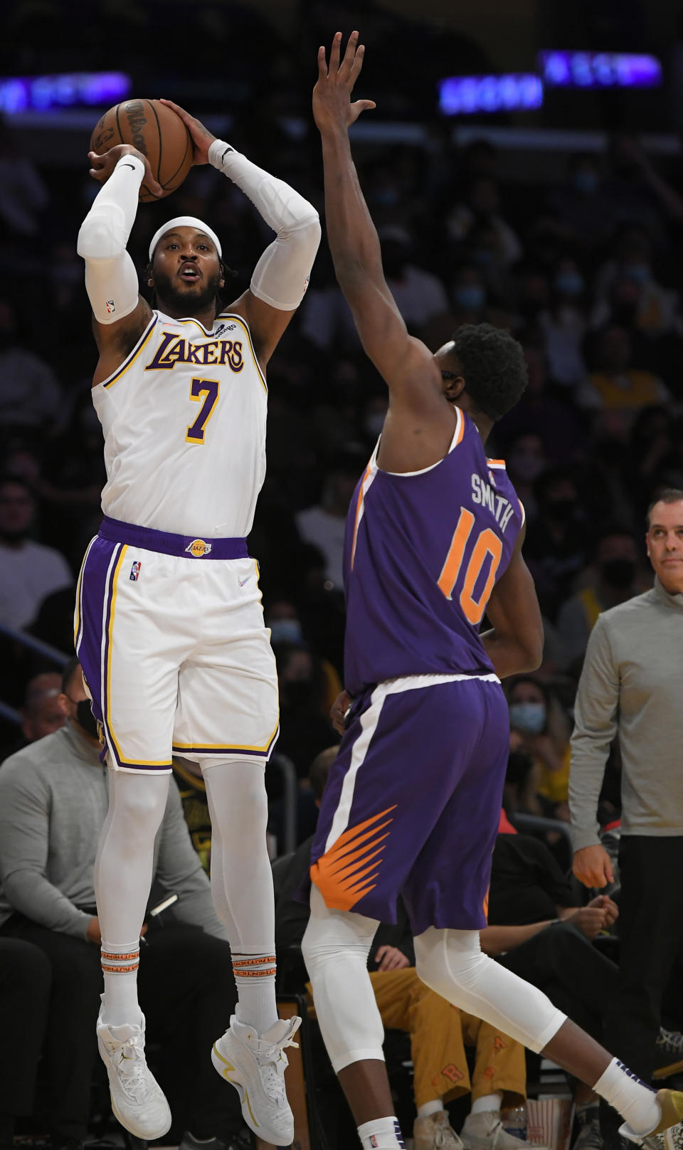 Los Angeles Lakers forward Carmelo Anthony (7) shoots the ball over Phoenix Suns forward Jalen Smith (10) in the second half of a preseason NBA basketball game in Los Angeles, Sunday, Oct. 10, 2021. (AP Photo/John McCoy)