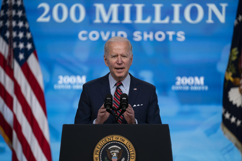 FILE - In this April 21, 2021, file photo, President Joe Biden speaks about COVID-19 vaccinations at the White House, in Washington. Biden spent his first 100 days encouraging Americans to mask up and stay home to slow the spread of COVID-19. His task for the next 100 will be to encourage the opposite behavior and manage the nation’s transition back to normalcy. (AP Photo/Evan Vucci, File)