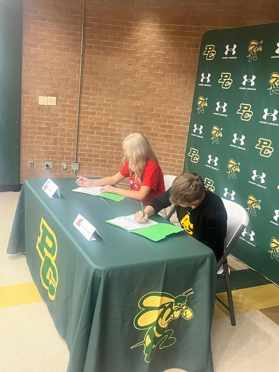 Pueblo County Hornets Leigha Cox and Tony Macaluso sign the letters of intent to play lacrosse and wrestling at the college level.