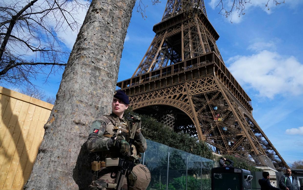 A soldier patrolling at the Eiffel Tower