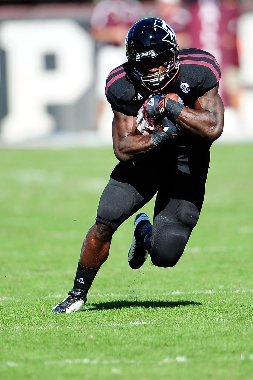 Christine Michael #33 of the Texas A&M Aggies runs for yards against the Mississippi State Bulldogs at Wade Davis Stadium on November 3, 2012 in Starkville, Mississippi. (Photo by Stacy Revere/Getty Images)