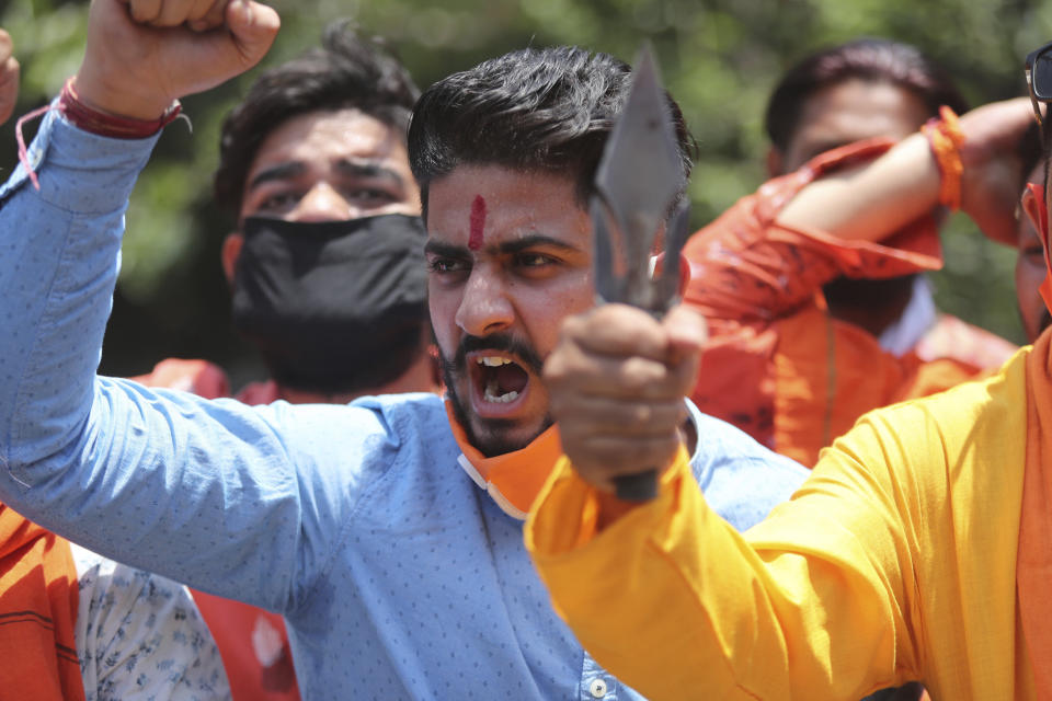Activists of Rashtriya Bajrang Dal shout slogans during a protest against the Chinese government in Jammu, India, Wednesday, June 17, 2020. As some commentators clamored for revenge, India's government was silent Wednesday on the fallout from clashes with China's army in a disputed border area in the high Himalayas that the Indian army said claimed 20 soldiers' lives. An official Communist Party newspaper said the clash occurred because India misjudged the Chinese army’s strength and willingness to respond. (AP Photo/Channi Anand)