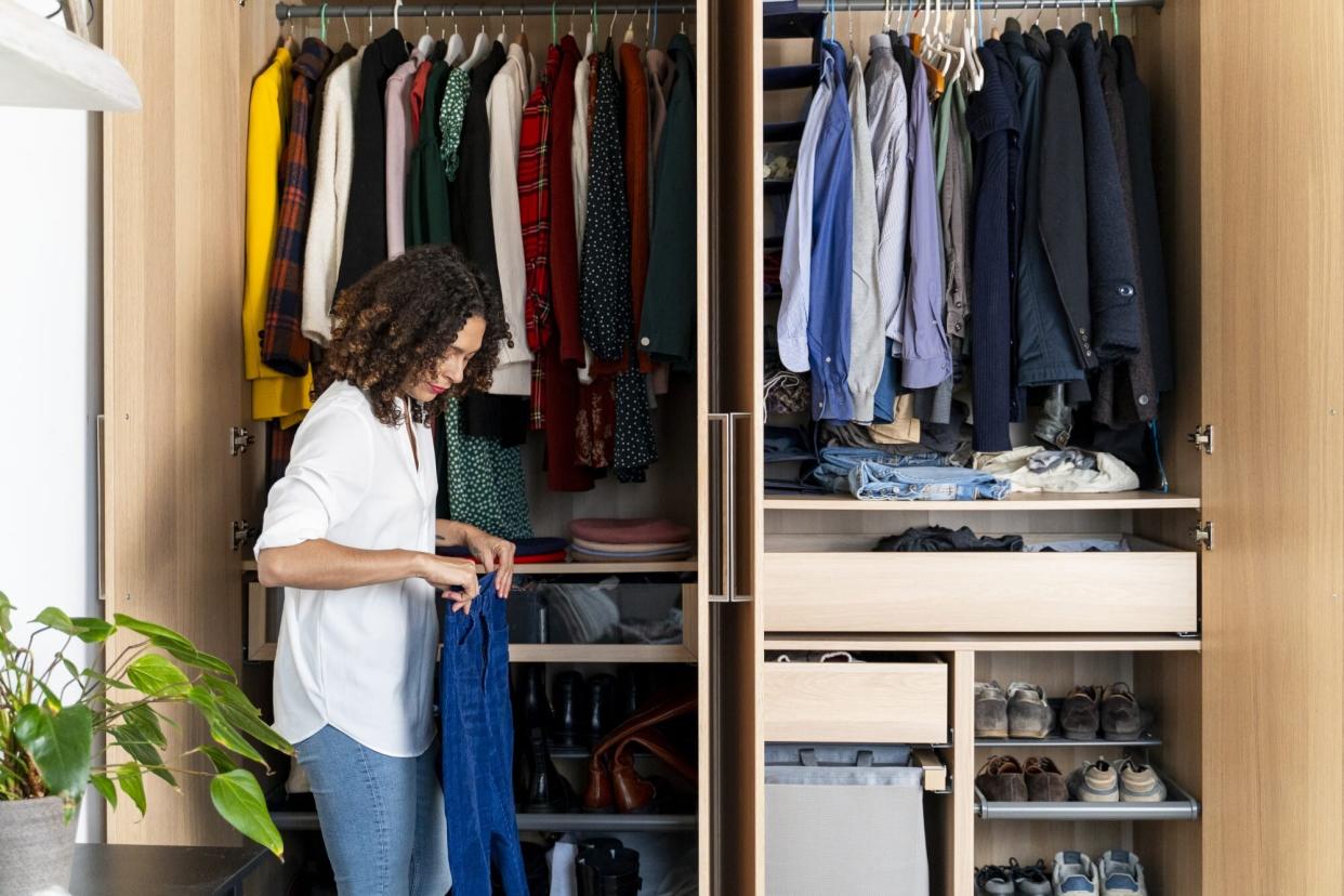 woman organizing closet