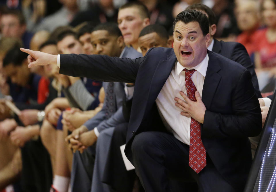 FILE - In this Jan. 29, 2014, file photo, Arizona coach Sean Miller gestures to his players during an NCAA college basketball game against Stanford in Stanford, Calif. John Miller’s sons _ Sean, who coaches No. 1 West seed Arizona; and younger brother Archie, who coaches No. 11 South seed Dayton _ could meet in the Final Four. (AP Photo/Marcio Jose Sanchez, File)