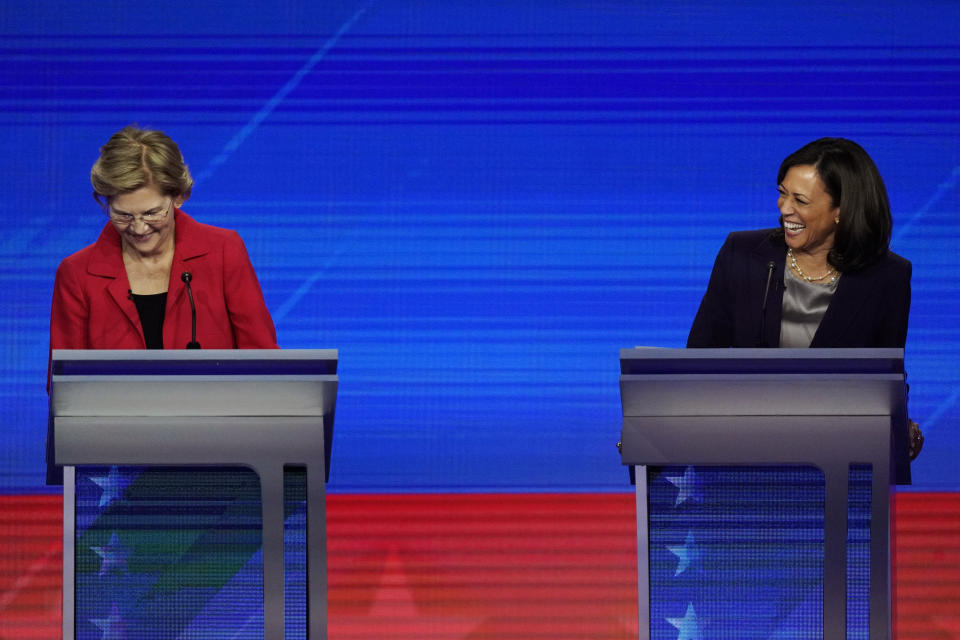 Democratic presidential candidates Sen. Elizabeth Warren, D-Mass. and Sen. Kamala Harris, D-Calif., laugh Thursday, Sept. 12, 2019, during a Democratic presidential primary debate hosted by ABC at Texas Southern University in Houston. (AP Photo/David J. Phillip)