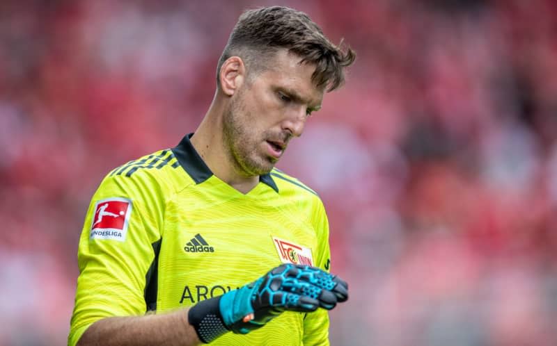 Then Union Berlin goalkeeper Andreas Luthe reatcs during the German Bundesliga soccer match between 1. FC Union Berlin and FC Augsburg. Luthe will play his first match for VfL Bochum in more than eight years in Saturday's Bundesliga date with RB Leipzig. Andreas Gora/dpa