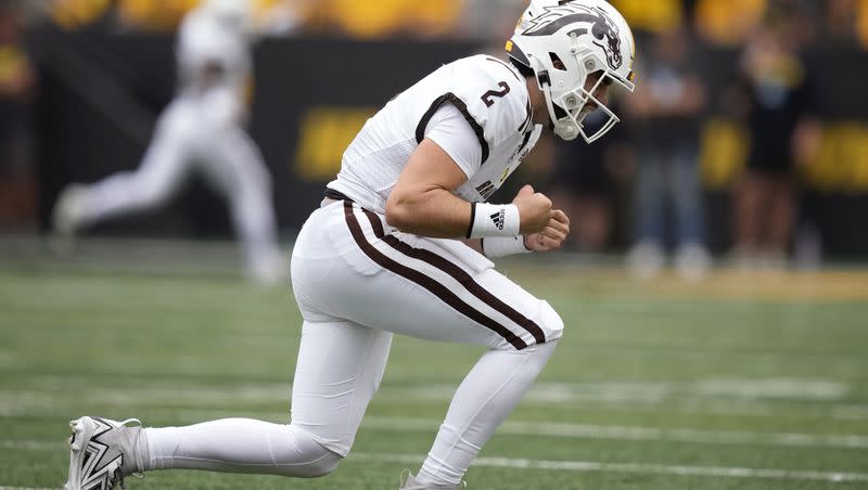 Western Michigan quarterback Treyson Bourguet celebrates after throwing a 64-yard touchdown pass during the first half of an NCAA college football game against Iowa, Saturday, Sept. 16, 2023, in Iowa City, Iowa. (AP Photo/Charlie Neibergall)