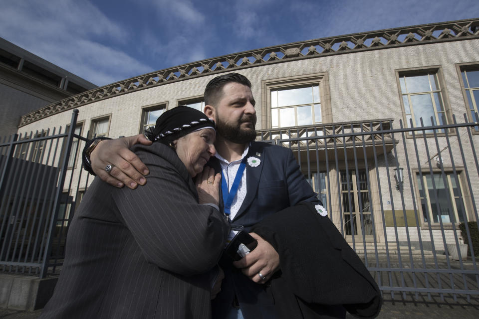 Aisha Omerovic of the Mothers of Srebrenica, is comforted after the court upheld the convictions of former Bosnian Serb leader Radovan Karadzic at International Residual Mechanism for Criminal Tribunals in The Hague, Netherlands, Wednesday, March 20, 2019. Nearly a quarter of a century since Bosnia's devastating war ended, Karadzic heard the final judgment upholding 2016 convictions for genocide, crimes against humanity and war crimes, and increased his 40-year sentence to life. (AP Photo/Peter Dejongl)