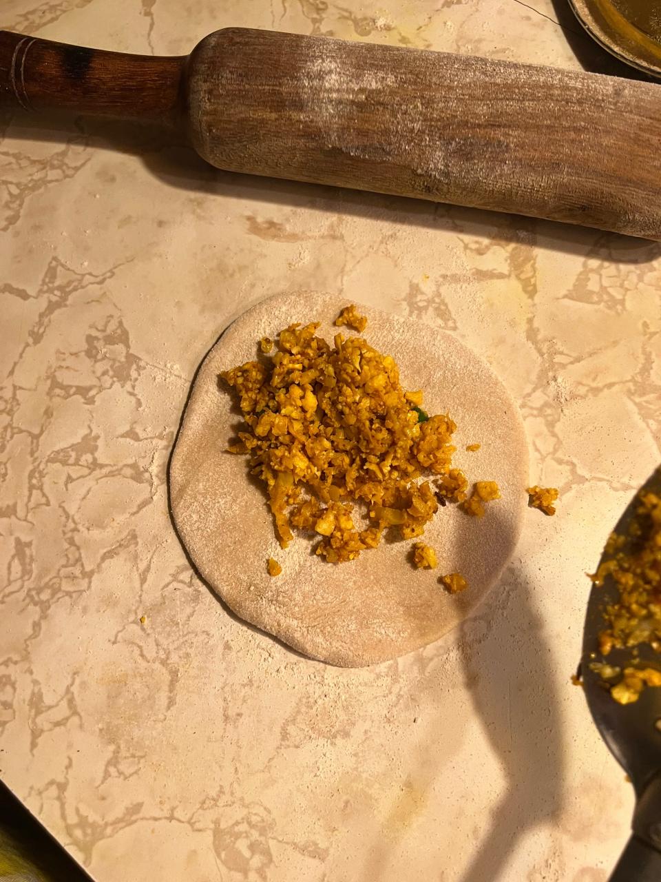 Shredded gobi, or cauliflower, added to the rolled-out dough.