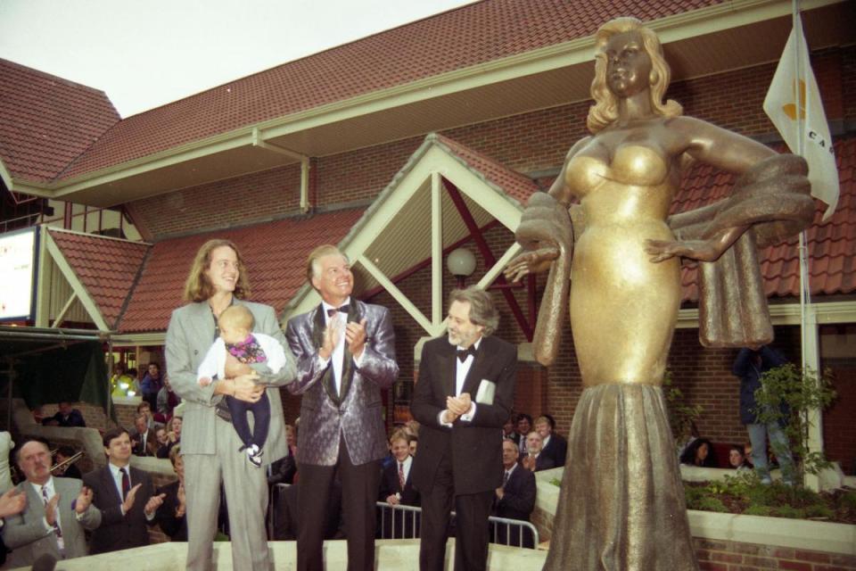 Diana's son Jason stands with filmmaker David Puttnam at the grand unveiling of his mother's statue in 1991. <i>(Image: Richard Wintle, Caylx Archive)</i>