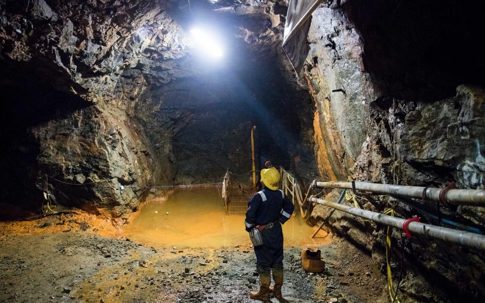 Keith Russ, a technical service engineer of the South Crofty Tin Project, stands in a mining tunnel at South Crofty tin mine in Redruth, - Simon Dawson/ Bloomberg News