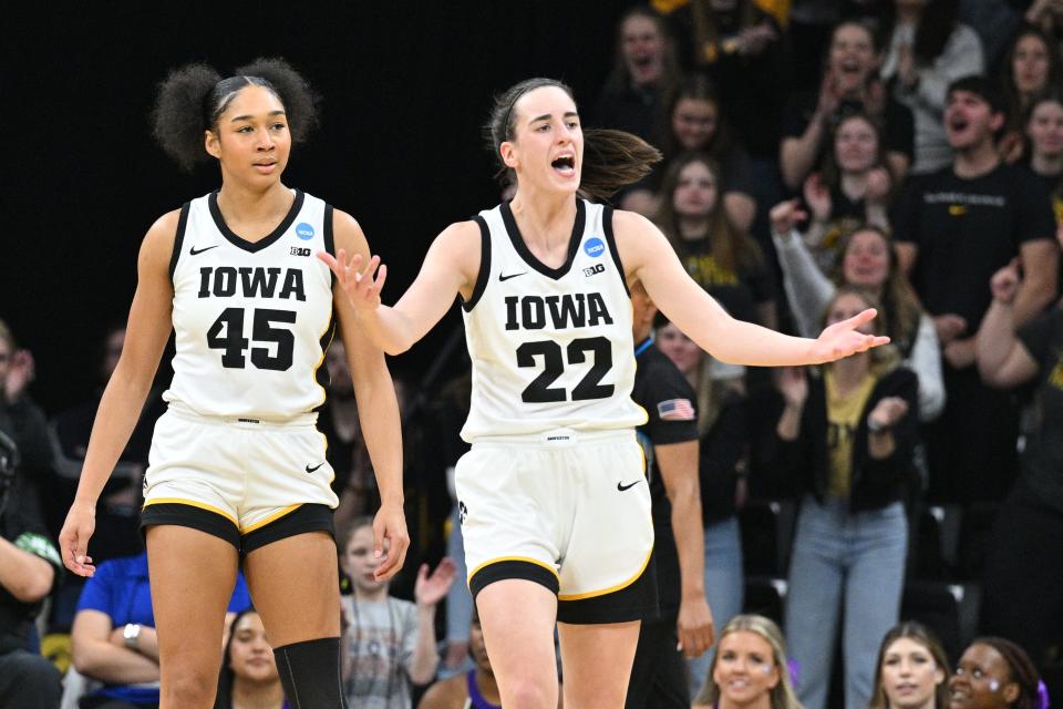 Iowa Hawkeyes guard Caitlin Clark (22) and forward Hannah Stuelke (45) during the NCAA first-round game against the Holy Cross Crusaders.