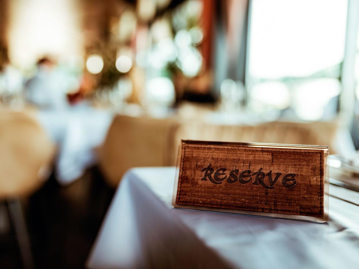 Reserved sign on the table in a fancy restaurant