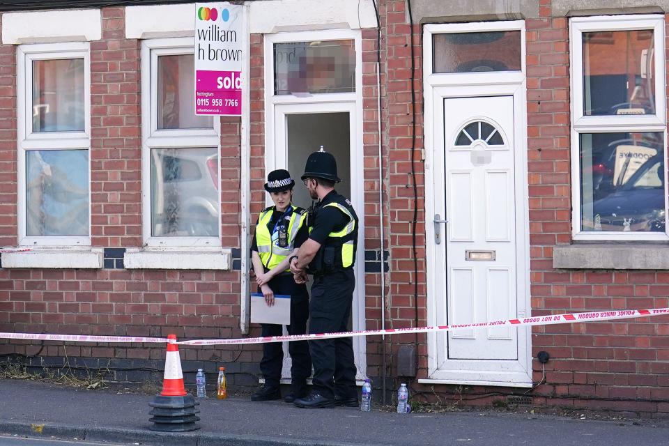 EDITORS NOTE PICTURE PIXELATED BY PA PICTURE DESK Police officers at an address on Ilkeston Road in Nottingham, as three people have been found dead in the city in what police described as a 