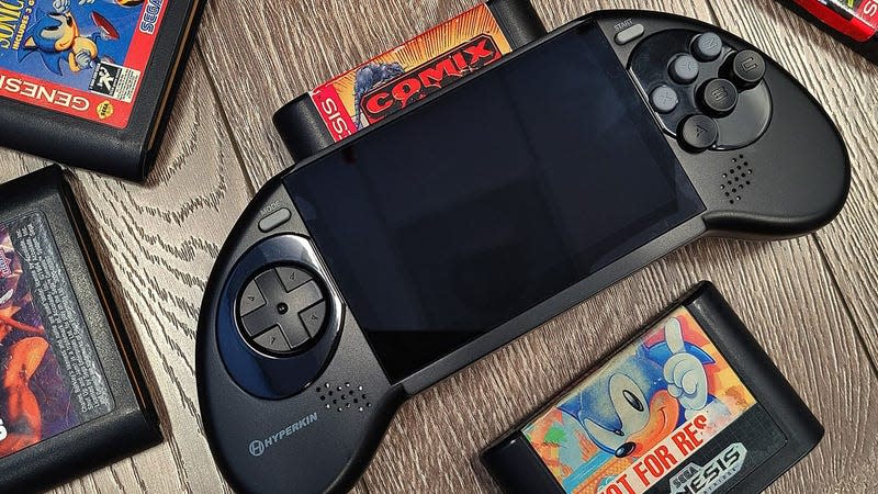 Hyperkin's Mega 95 handheld console, with some original carts.