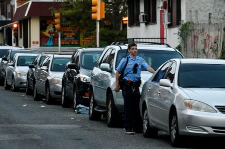 A police officer is seen during an active shooter situation in Philadelphia