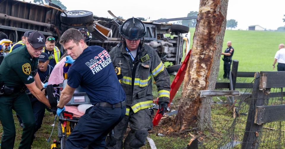 EMS workers are seen transporting one of the dozens injured in a fatal bus crash in Marion County, Florida, on Tuesday 14 May 2024 (Marion County Fire Rescue)