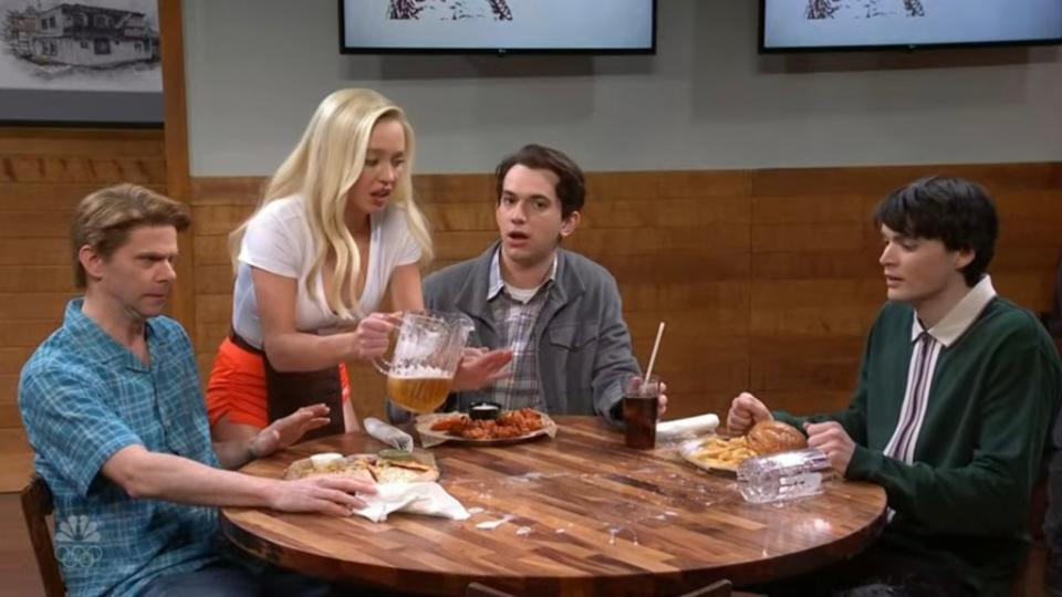 “Saturday Night Live” host Sydney Sweeney’s clumsy serving skills didn’t matter to the group of guys she served in a recent skit. NBC / SNL