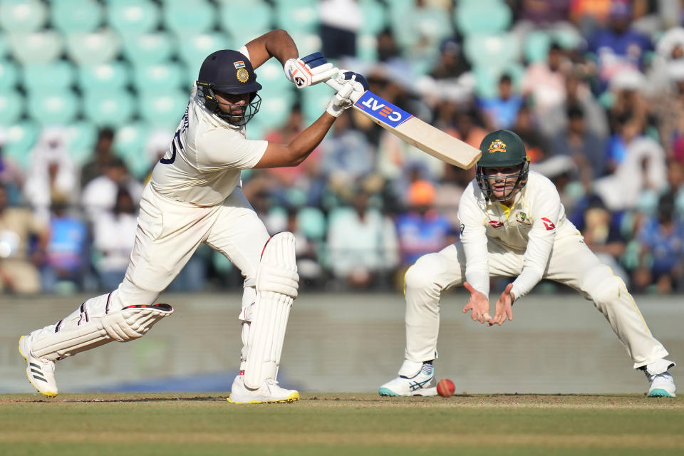 India's captain Rohit Sharma, left, plays a shot during the first day of the first cricket test match between India and Australia in Nagpur, India, Thursday, Feb. 9, 2023. (AP Photo/Rafiq Maqbool)