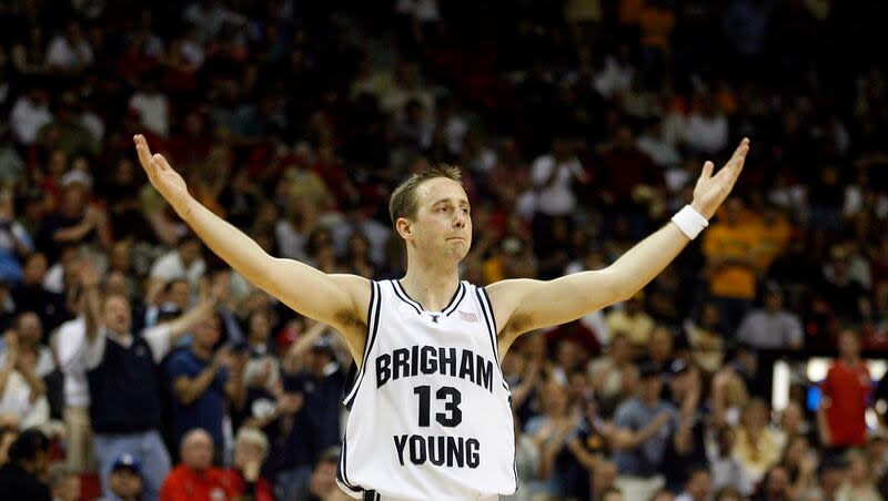 Brigham Young's Austin Ainge raises his hands to the crowd during the final seconds of a Mountain West conference men's basketball tournament game against Wyoming in Las Vegas, Friday, March 9, 2007. Ainge is reportedly in the running to become the next GM of the Charlotte Hornets.