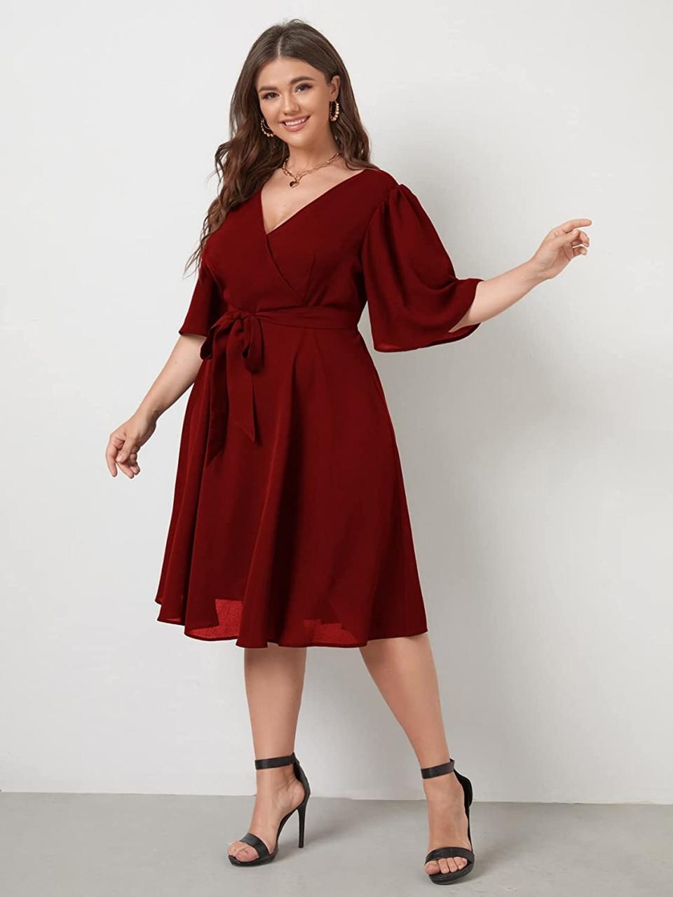 Romwe Women's Plus Size Bell Sleeve V Neck Wrap Dress. Image via Amazon.