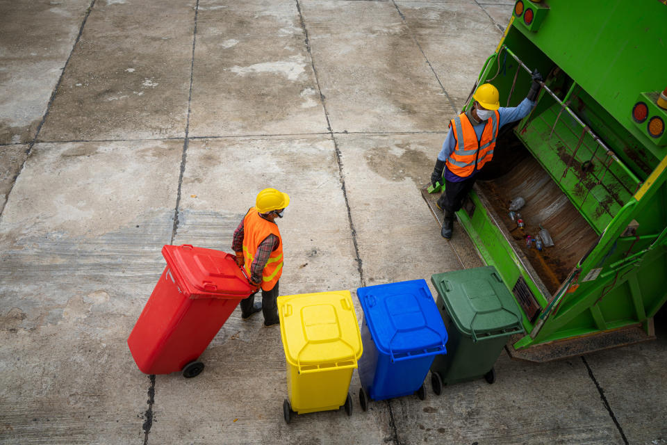 garbage disposal people working