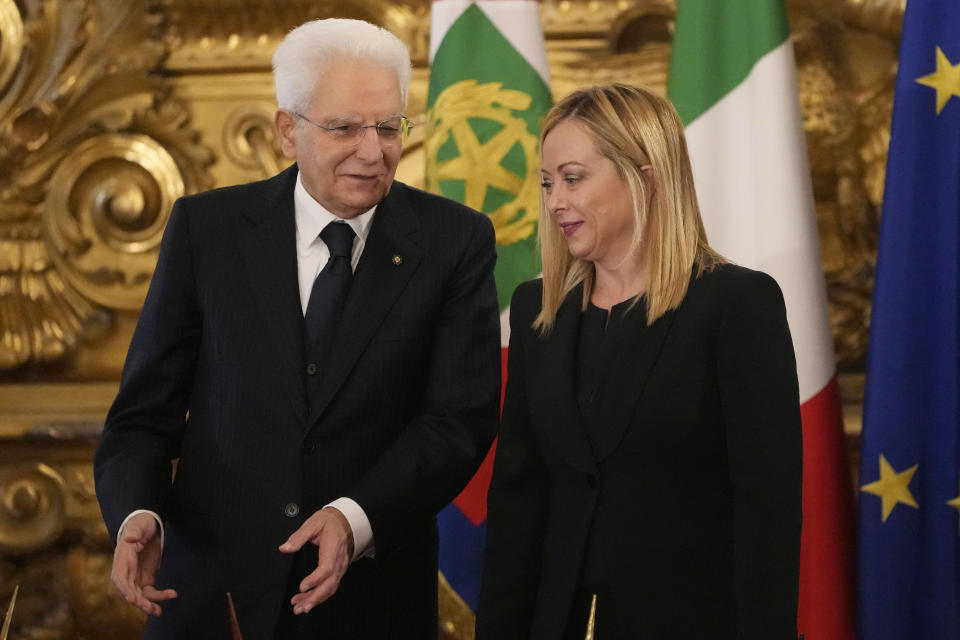 Italian President Sergio Mattarella gestures with the newly appointed Italian Premier Giorgia Meloni during the swearing in ceremony at Quirinal presidential palace in Rome, Saturday, Oct. 22, 2022. (AP Photo/Alessandra Tarantino)