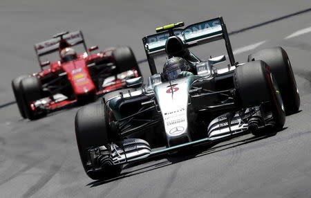 Mercedes Formula One driver Nico Rosberg of Germany leads his countrymate Ferrari's Sebastian Vettel during the Monaco F1 Grand Prix May 24, 2015. REUTERS/Max Rossi