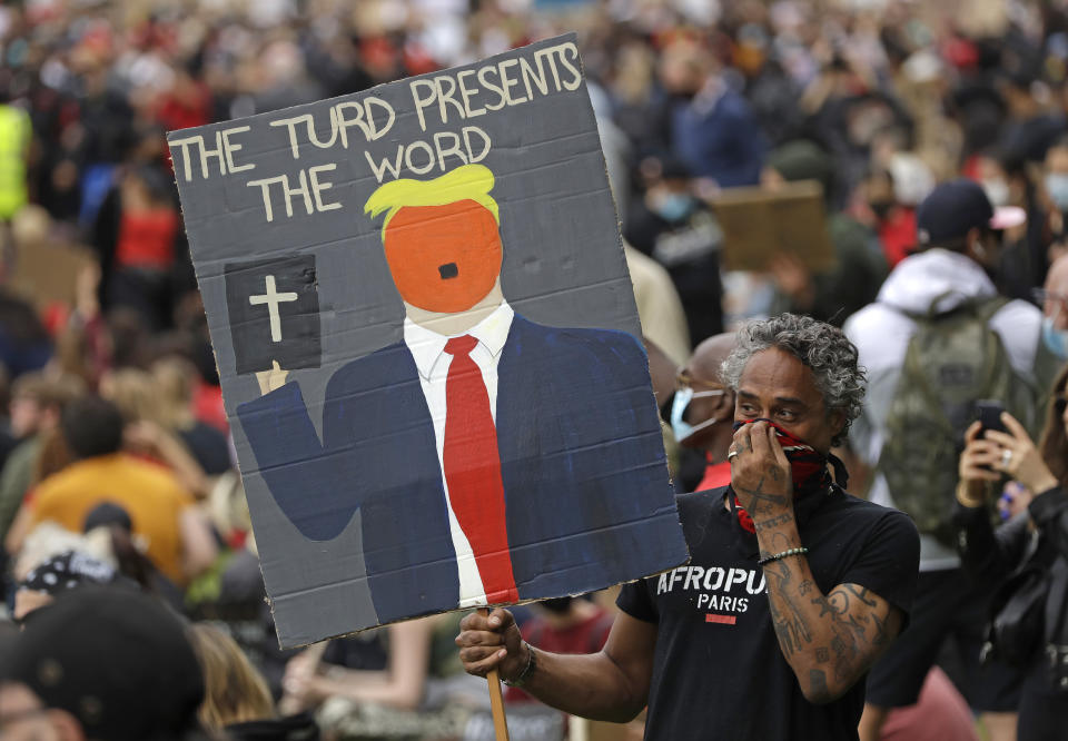 Protesters take part in a demonstration on Wednesday, June 3, 2020, in Hyde Park, London, over the death of George Floyd, a black man who died after being restrained by Minneapolis police officers on May 25. Protests have taken place across America and internationally, after a white Minneapolis police officer pressed his knee against Floyd's neck while the handcuffed black man called out that he couldn't breathe. The officer, Derek Chauvin, has been fired and charged with murder. (AP Photo/Matt Dunham)