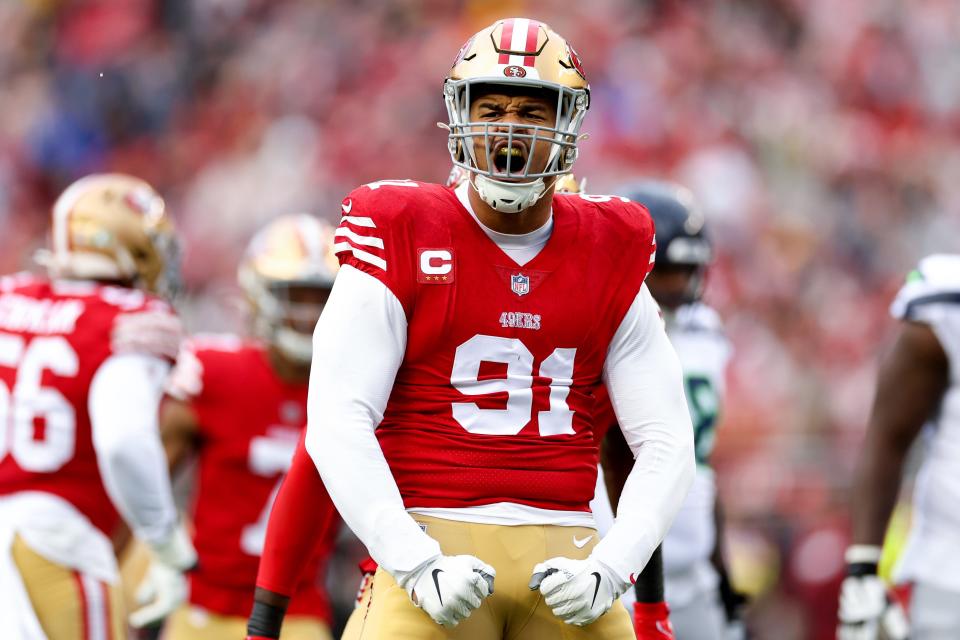 SANTA CLARA, CALIFORNIA - JANUARY 14: Arik Armstead #91 of the San Francisco 49ers celebrates after sacking Geno Smith #7 of the Seattle Seahawks during the first quarter in the NFC Wild Card playoff game at Levi's Stadium on January 14, 2023 in Santa Clara, California. (Photo by Ezra Shaw/Getty Images)