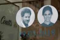 Pictures of Britain's Prince Harry and his fiancee, US actress Meghan Markle are displayed in a shop window in central London