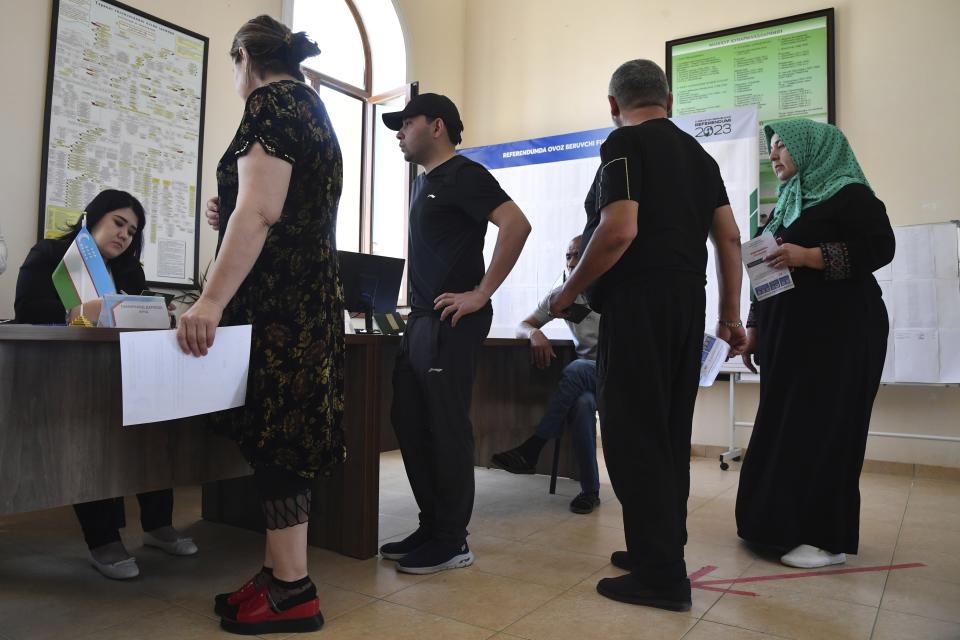 Voters lineup to get their ballots at a polling station during a referendum in Tashkent, Uzbekistan, Sunday, April 30, 2023. Voters in Uzbekistan are casting ballots in a referendum on a revised constitution that promises human rights reforms. But the reforms being voted on Sunday also would allow the country's president to stay in office until 2040. (AP Photo)