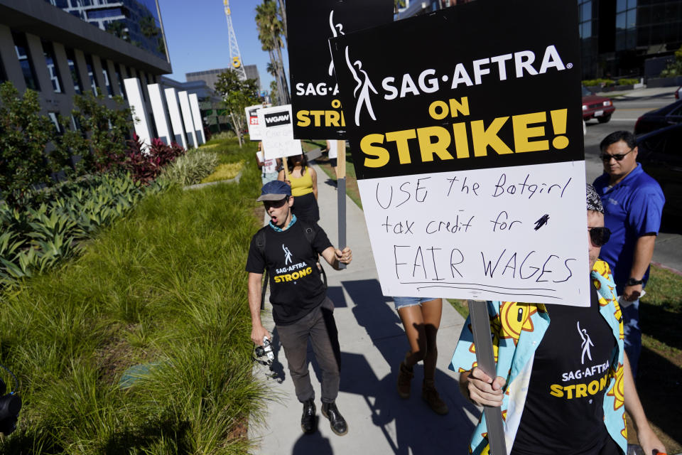 Striking writers and actors take part in a rally outside Netflix studio in Los Angeles on Friday, July 14, 2023. This marks the first day actors formally joined the picket lines, more than two months after screenwriters began striking in their bid to get better pay and working conditions. (AP Photo/Chris Pizzello)